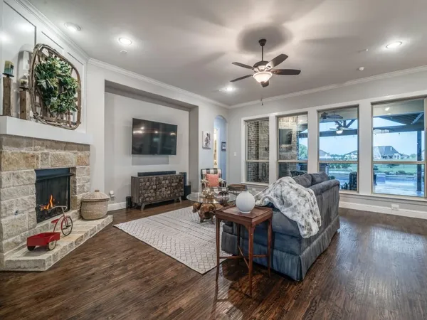 a living room with furniture fireplace and flat screen tv