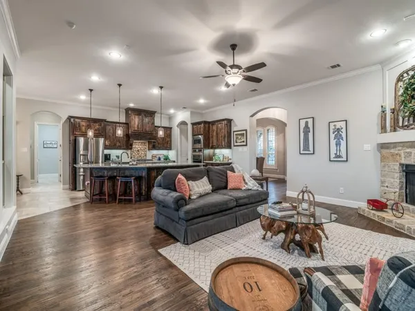 a living room with furniture and wooden floor