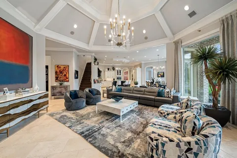 a living room with furniture fireplace and flat screen tv