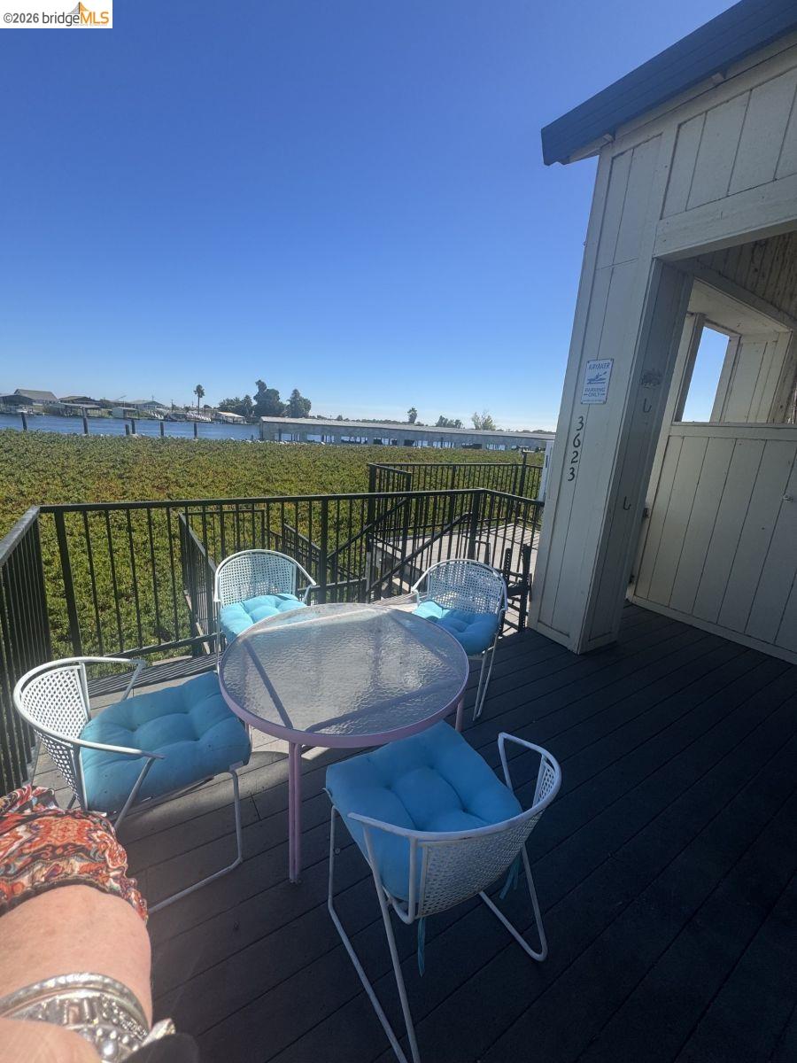 3623 Wells Road Oakley, CA 94561 - Photo 2 of 59 Outdoor deck with dark wood-finish flooring and black metal railings
