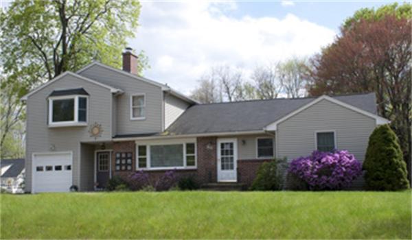 85 Maple Road Longmeadow, MA 01106 - Photo 1 of 30 a front view of a house with a garden and yard