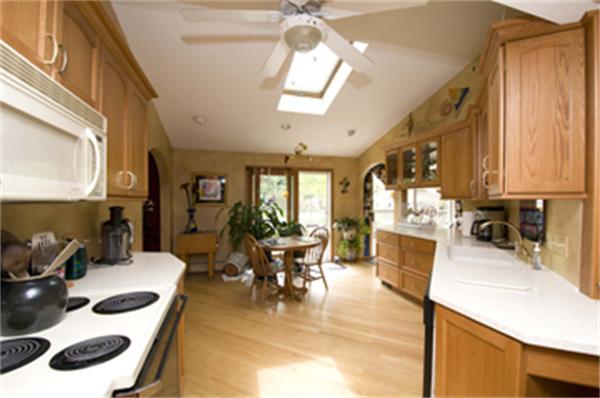 85 Maple Road Longmeadow, MA 01106 - Photo 14 of 30 a kitchen with a table chairs and a stove