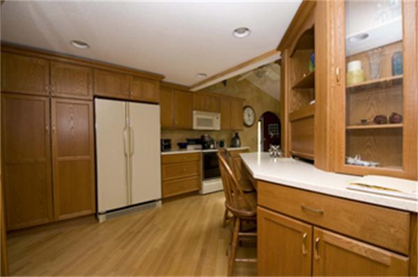 85 Maple Road Longmeadow, MA 01106 - Photo 16 of 30 a kitchen with a refrigerator a sink and cabinets