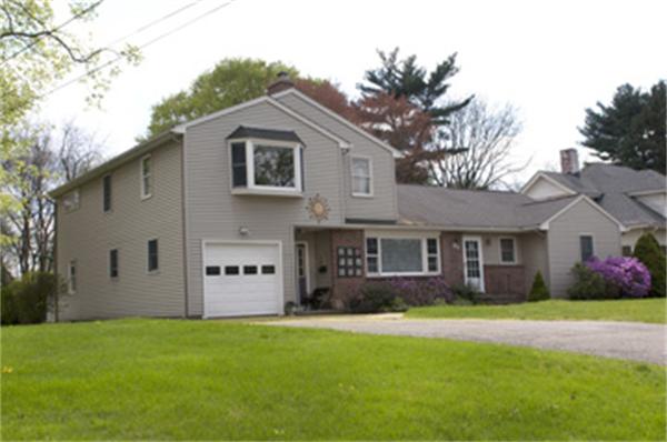 85 Maple Road Longmeadow, MA 01106 - Photo 2 of 30 a view of a white house with a big yard and large trees