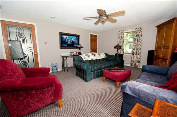 85 Maple Road Longmeadow, MA 01106 - Photo 21 of 30 a living room with furniture a flat screen tv and a couch