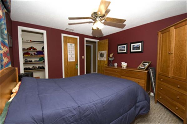 85 Maple Road Longmeadow, MA 01106 - Photo 4 of 30 a bedroom with a large bed closet and flat tv screen