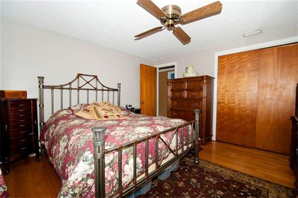 85 Maple Road Longmeadow, MA 01106 - Photo 6 of 30 a bedroom with a bed and wooden floor