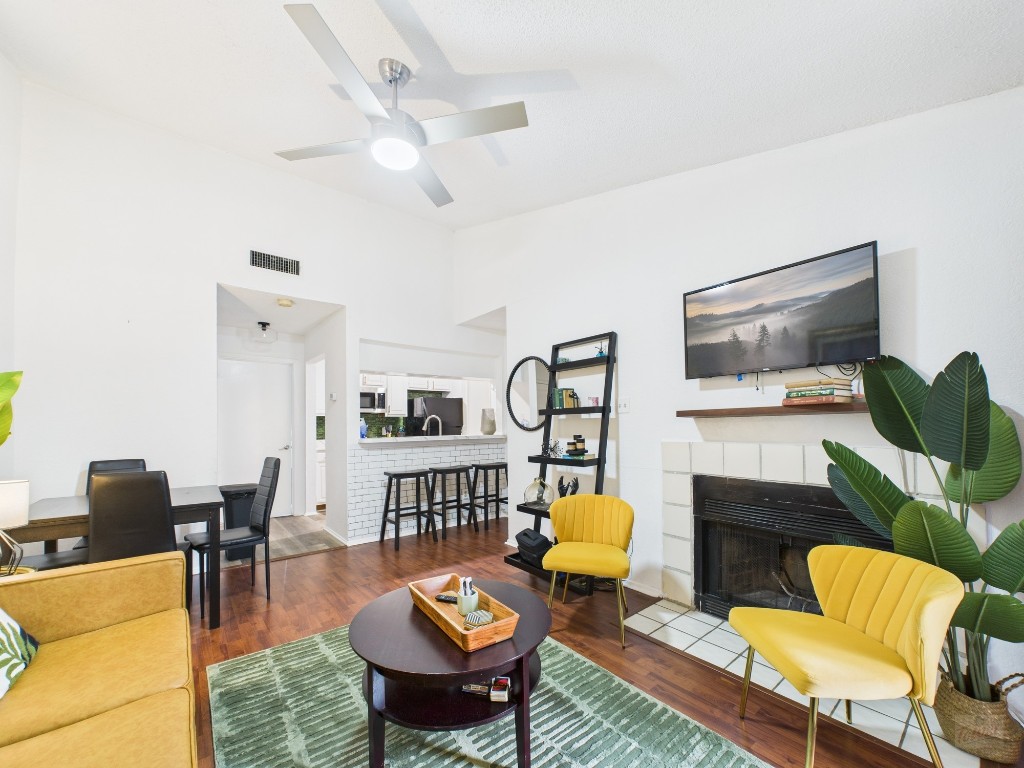 a living room with furniture and a flat screen tv