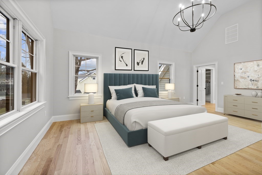 20 Harding Road Lexington, MA 02420 - Photo 13 of 41 a bedroom with a large bed and a chandelier