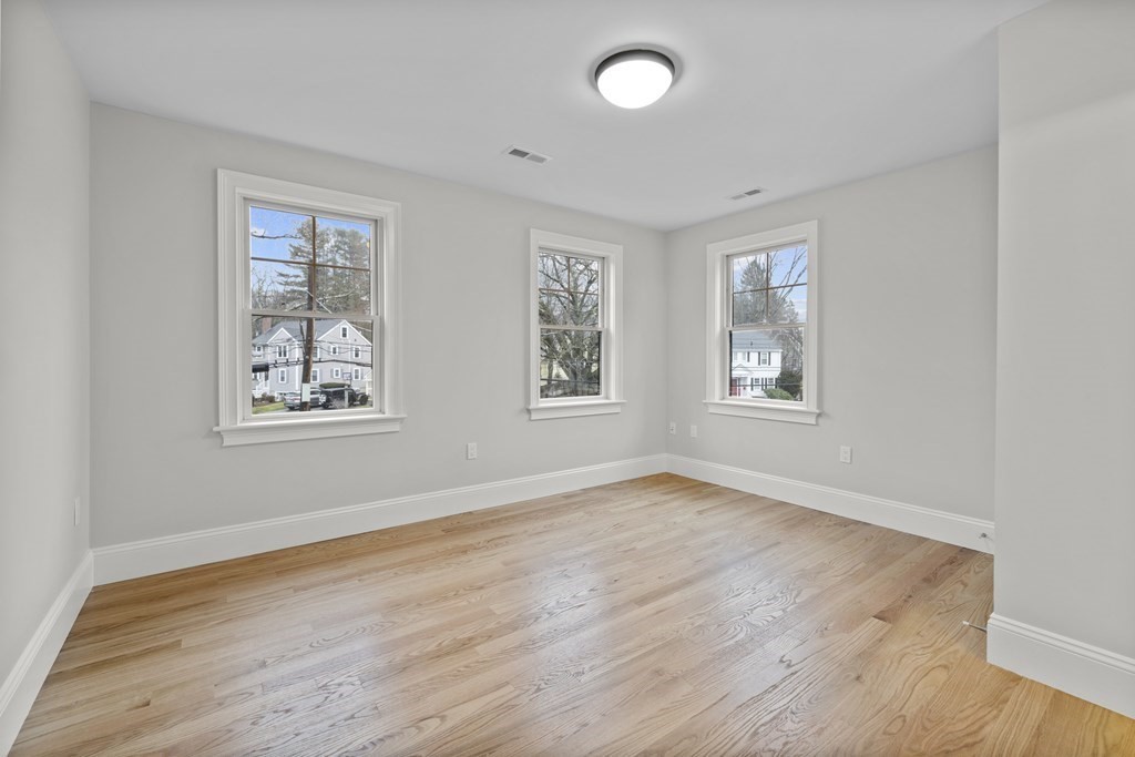 20 Harding Road Lexington, MA 02420 - Photo 19 of 41 a view of an empty room with a window and wooden floor