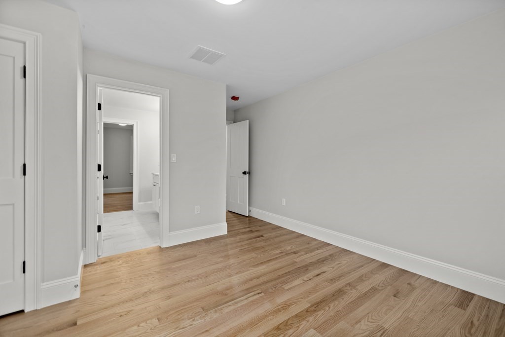 20 Harding Road Lexington, MA 02420 - Photo 20 of 41 a view of an empty room with wooden floor