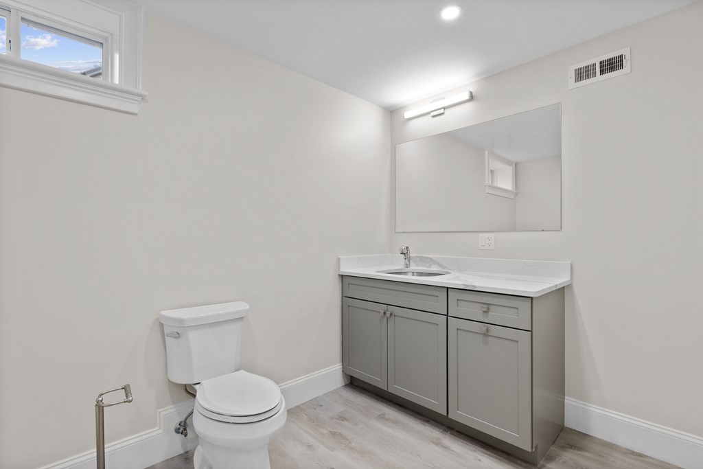 20 Harding Road Lexington, MA 02420 - Photo 30 of 41 a bathroom with a sink toilet and mirror