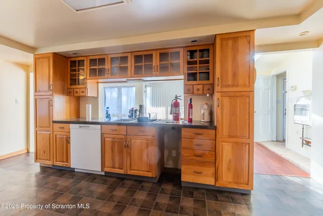 a view of kitchen with cabinets and wooden floor