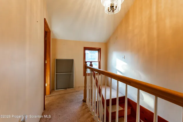 a view of a hallway with windows