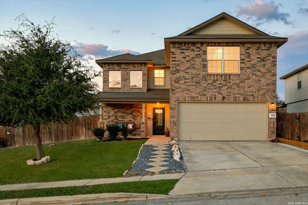 a front view of a house with a yard