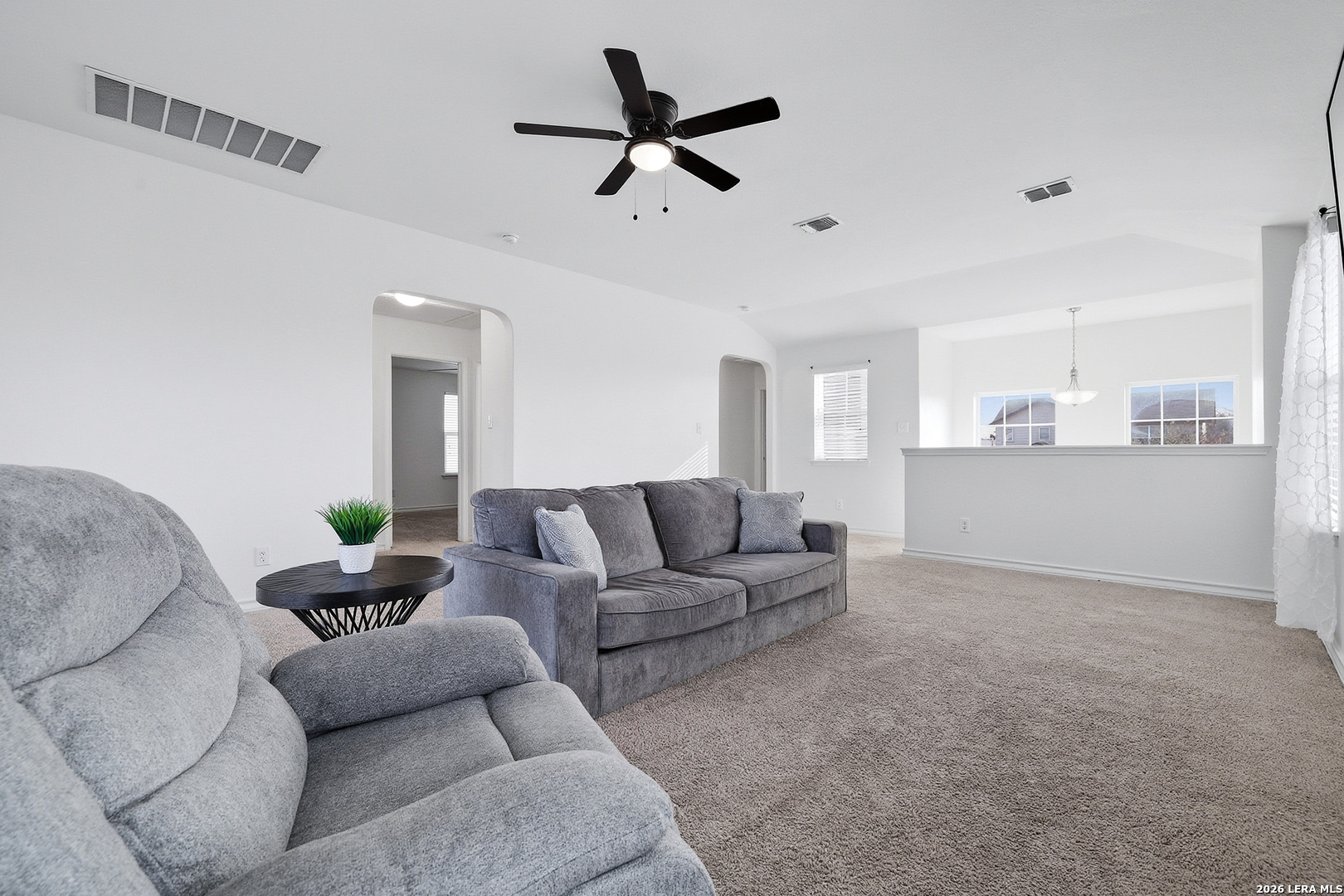 7435 Rigel Chase San Antonio, TX 78252 - Photo 24 of 38 a living room with furniture and kitchen view