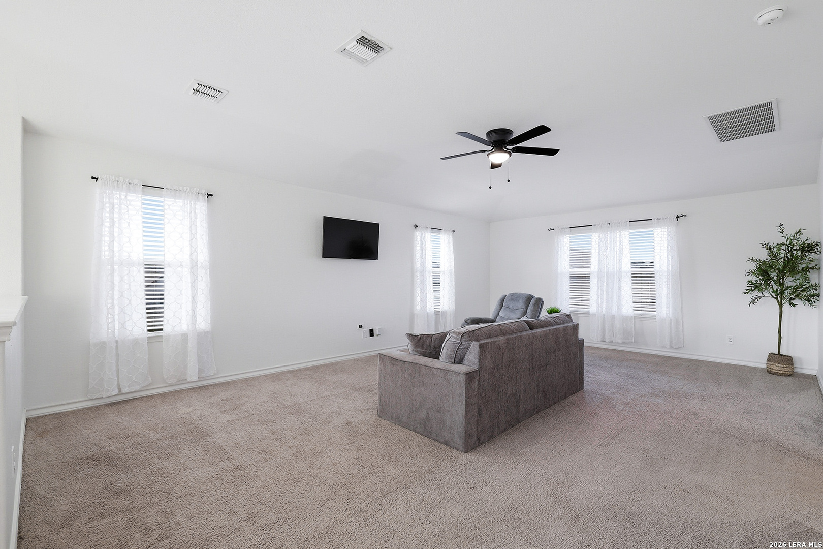 7435 Rigel Chase San Antonio, TX 78252 - Photo 25 of 38 a living room with furniture and a window