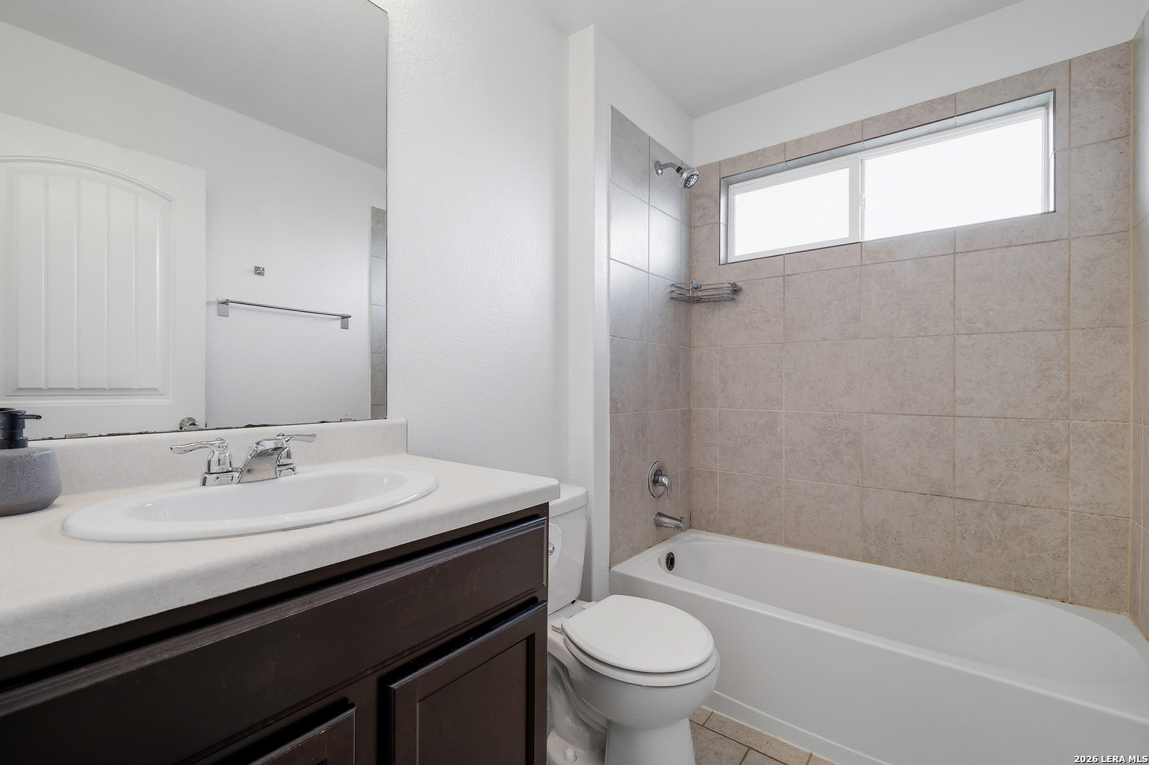 7435 Rigel Chase San Antonio, TX 78252 - Photo 31 of 38 a bathroom with a sink a toilet and shower