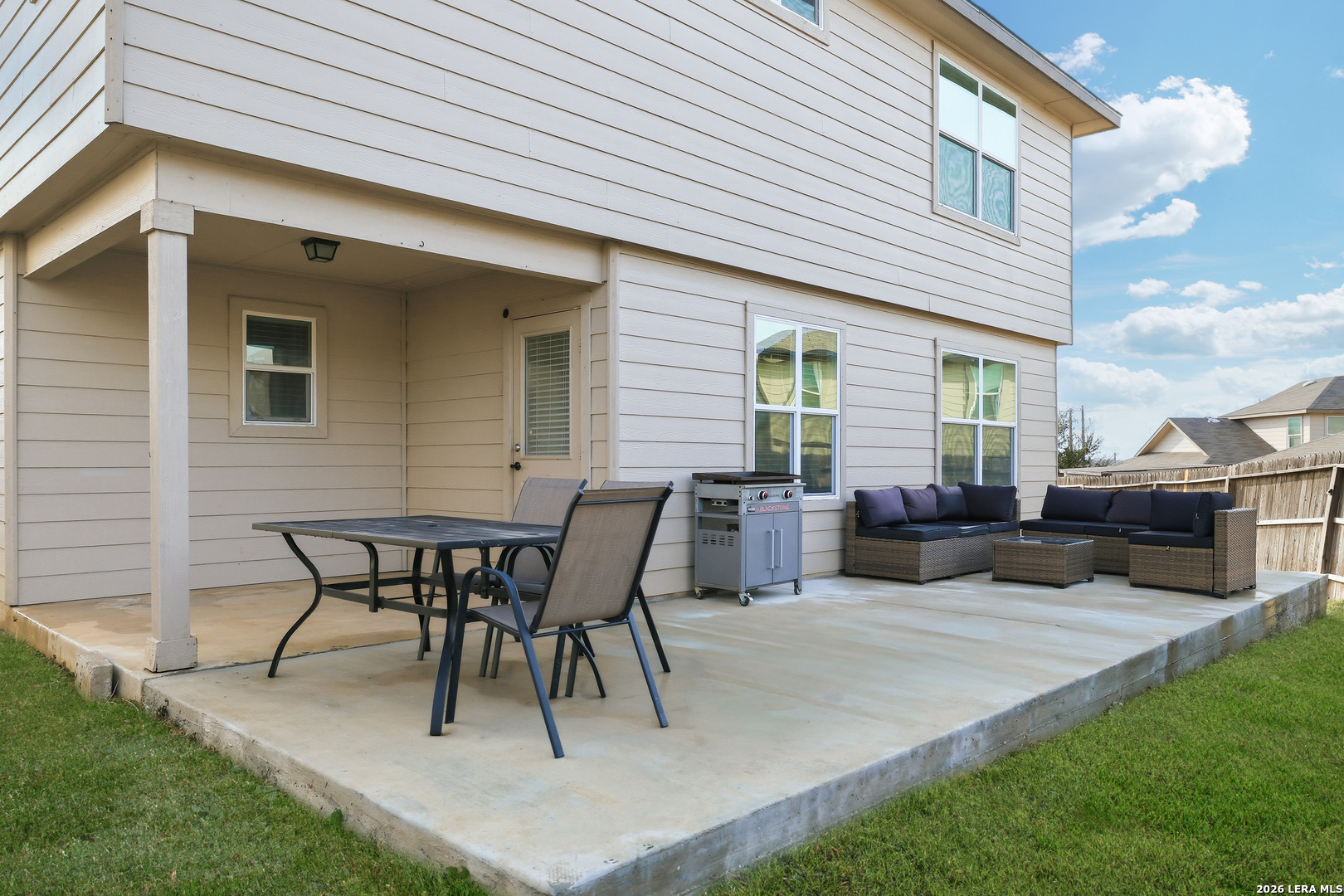 7435 Rigel Chase San Antonio, TX 78252 - Photo 33 of 38 a backyard of a house with table and chairs