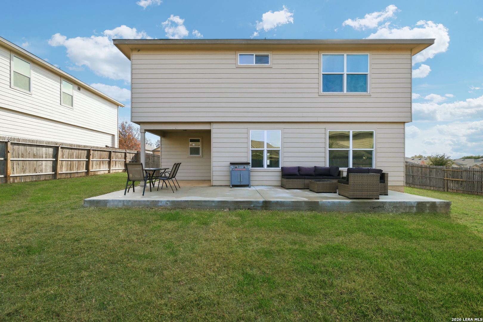 7435 Rigel Chase San Antonio, TX 78252 - Photo 37 of 38 a backyard of a house with table and chairs