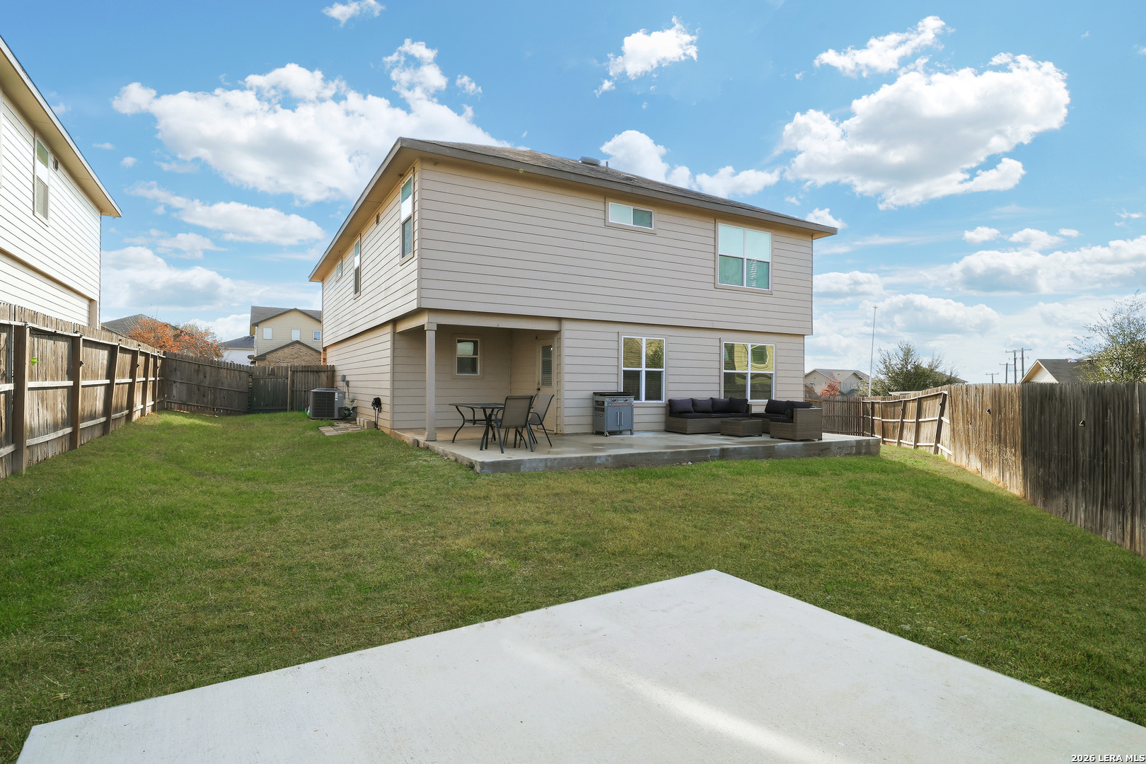 7435 Rigel Chase San Antonio, TX 78252 - Photo 38 of 38 a front view of a house with a garden