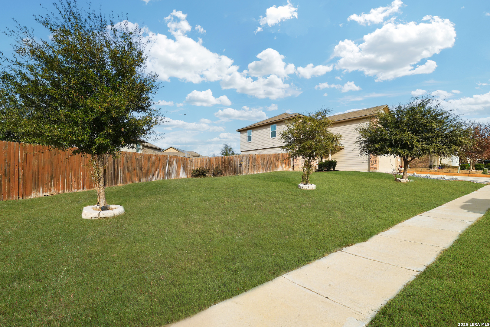 7435 Rigel Chase San Antonio, TX 78252 - Photo 4 of 38 a view of a house with a backyard