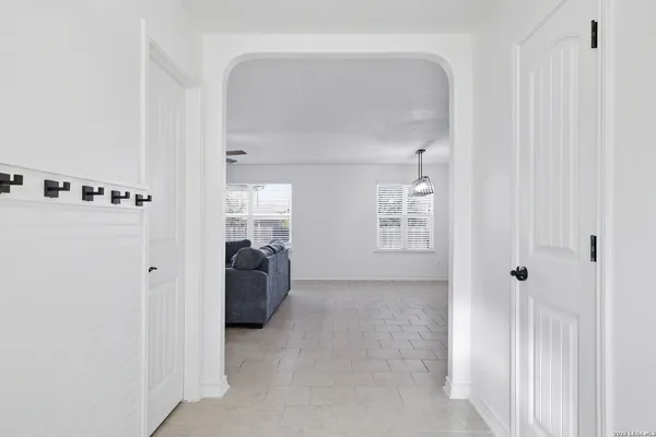 a view of a closet area with living room