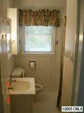 1210 Norland Road Charlotte, NC 28205 - Photo 4 of 8 a bathroom with a sink and a window