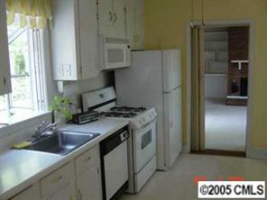 1210 Norland Road Charlotte, NC 28205 - Photo 5 of 8 a kitchen with a sink and a refrigerator