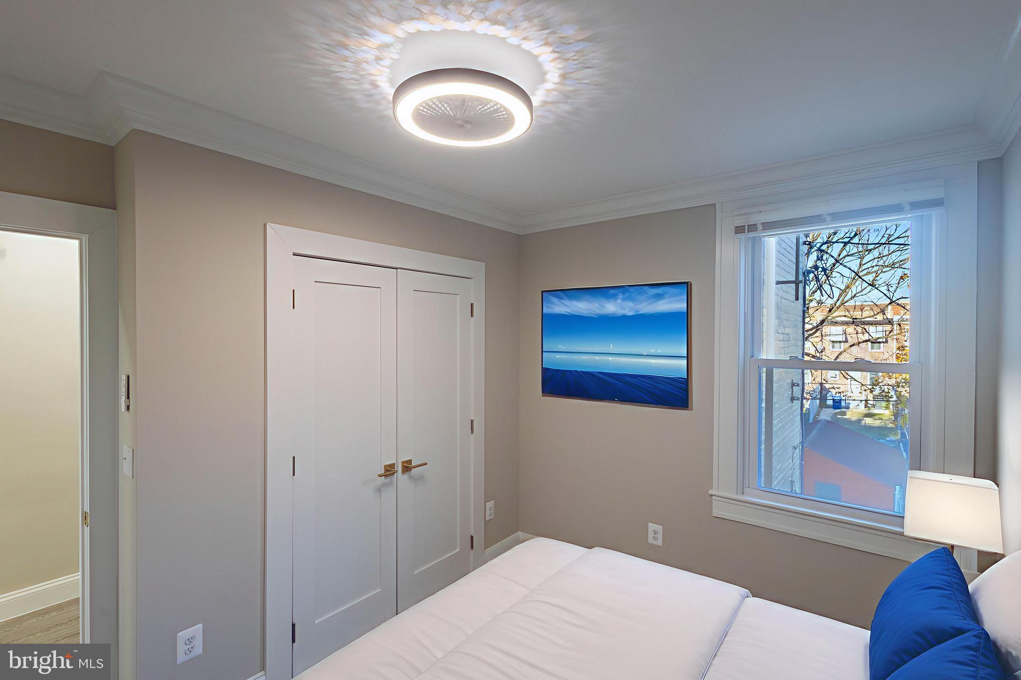 2846 Lake Avenue Baltimore, MD 21213 - Photo 16 of 28 a bedroom with a bed and a painting on the wall