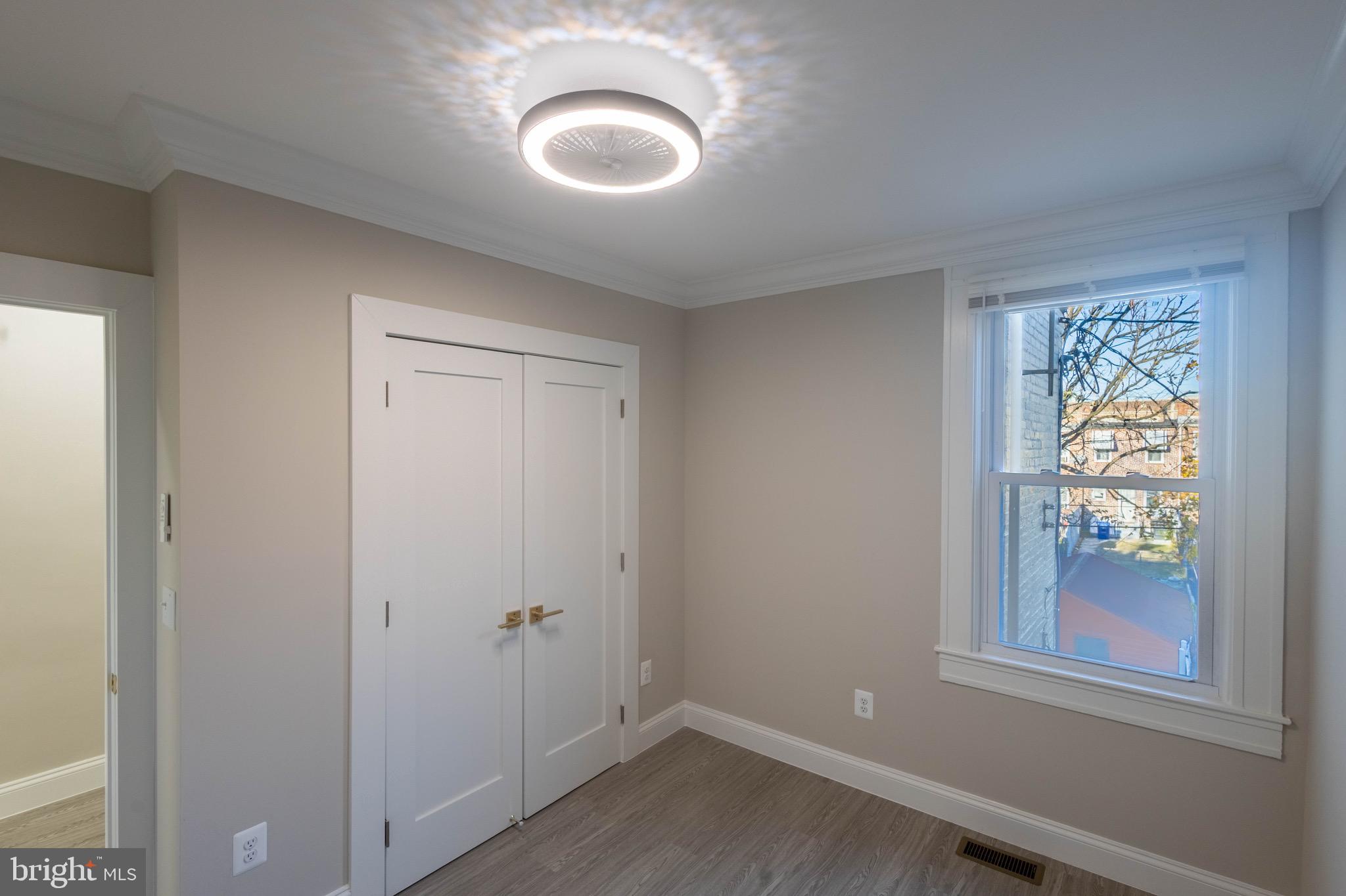 2846 Lake Avenue Baltimore, MD 21213 - Photo 17 of 28 a view of empty room with window