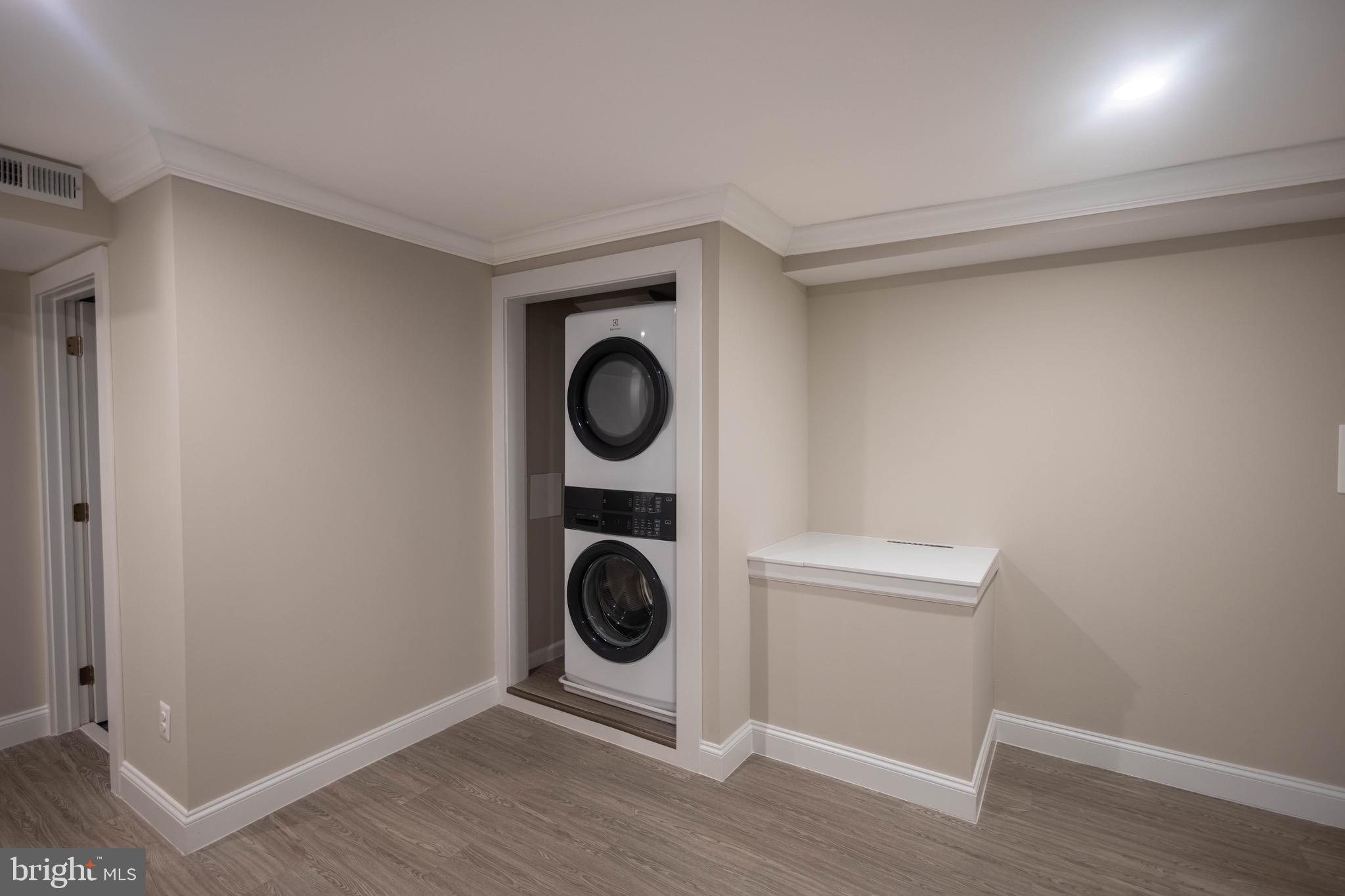 2846 Lake Avenue Baltimore, MD 21213 - Photo 26 of 28 a view of a storage & utility room with washer and dryer