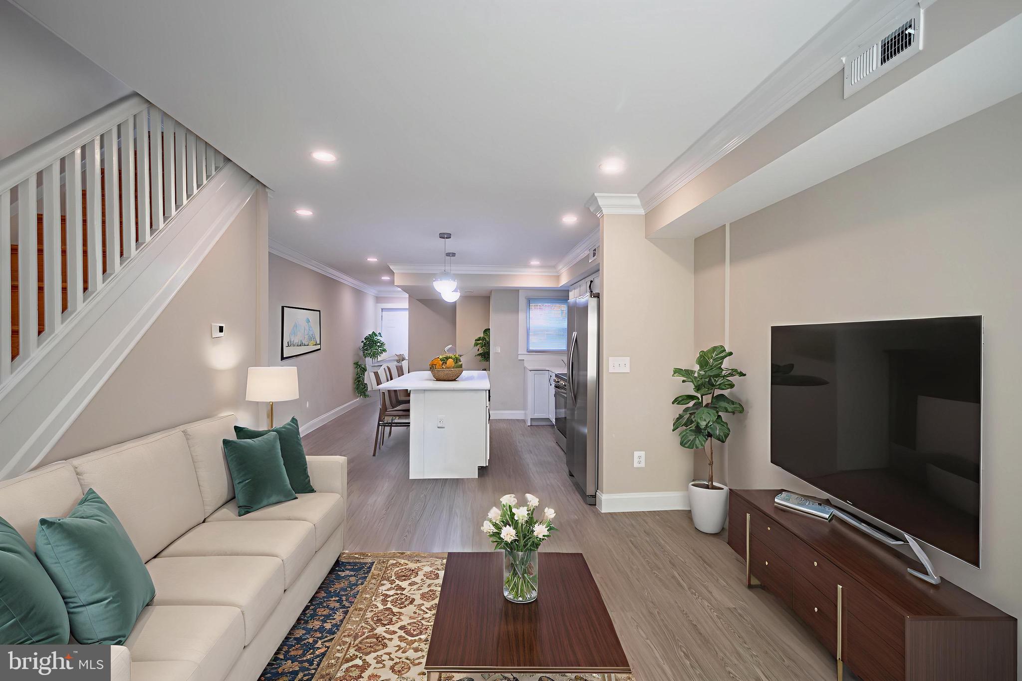 2846 Lake Avenue Baltimore, MD 21213 - Photo 6 of 28 a living room with furniture and a flat screen tv
