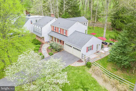 a aerial view of a house with a yard