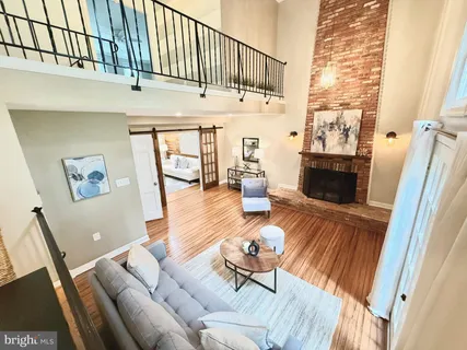 a view of a livingroom with furniture and a fireplace
