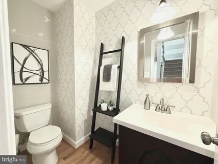 a view of a dining room with furniture wooden floor and chandelier