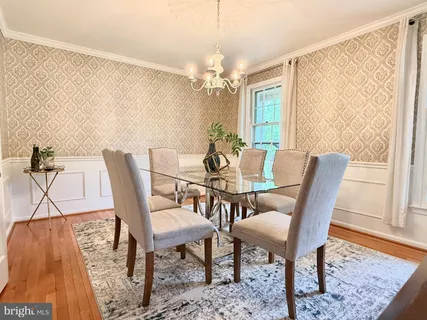 a view of staircase with railing and white walls