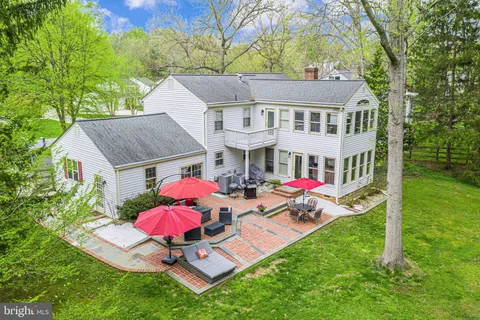 a view of a field with trees in front of it