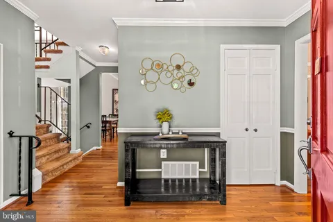 a living room with furniture a large window with wooden floor