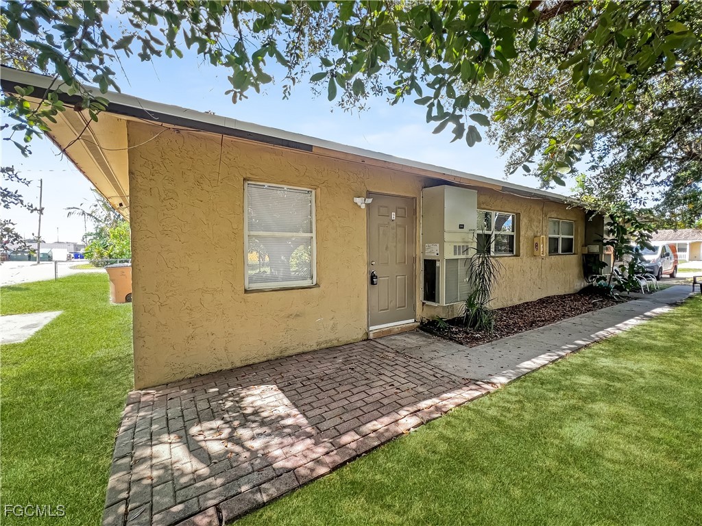 a view of a backyard with a tree