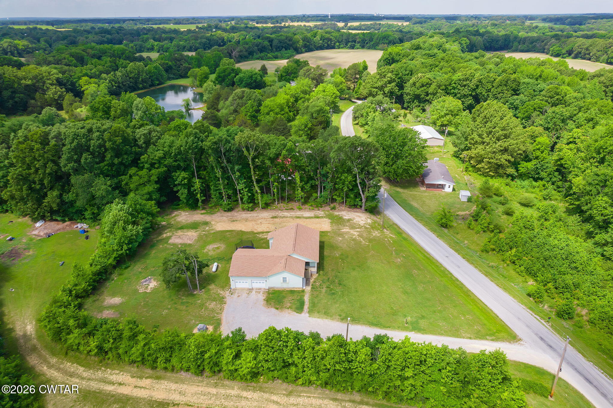 306 Jim Jackson Road Humboldt, TN 38343 - Photo 4 of 29 an aerial view of residential houses with outdoor space and street view