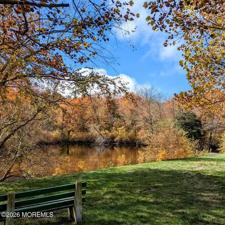 a view of lake from next to a building