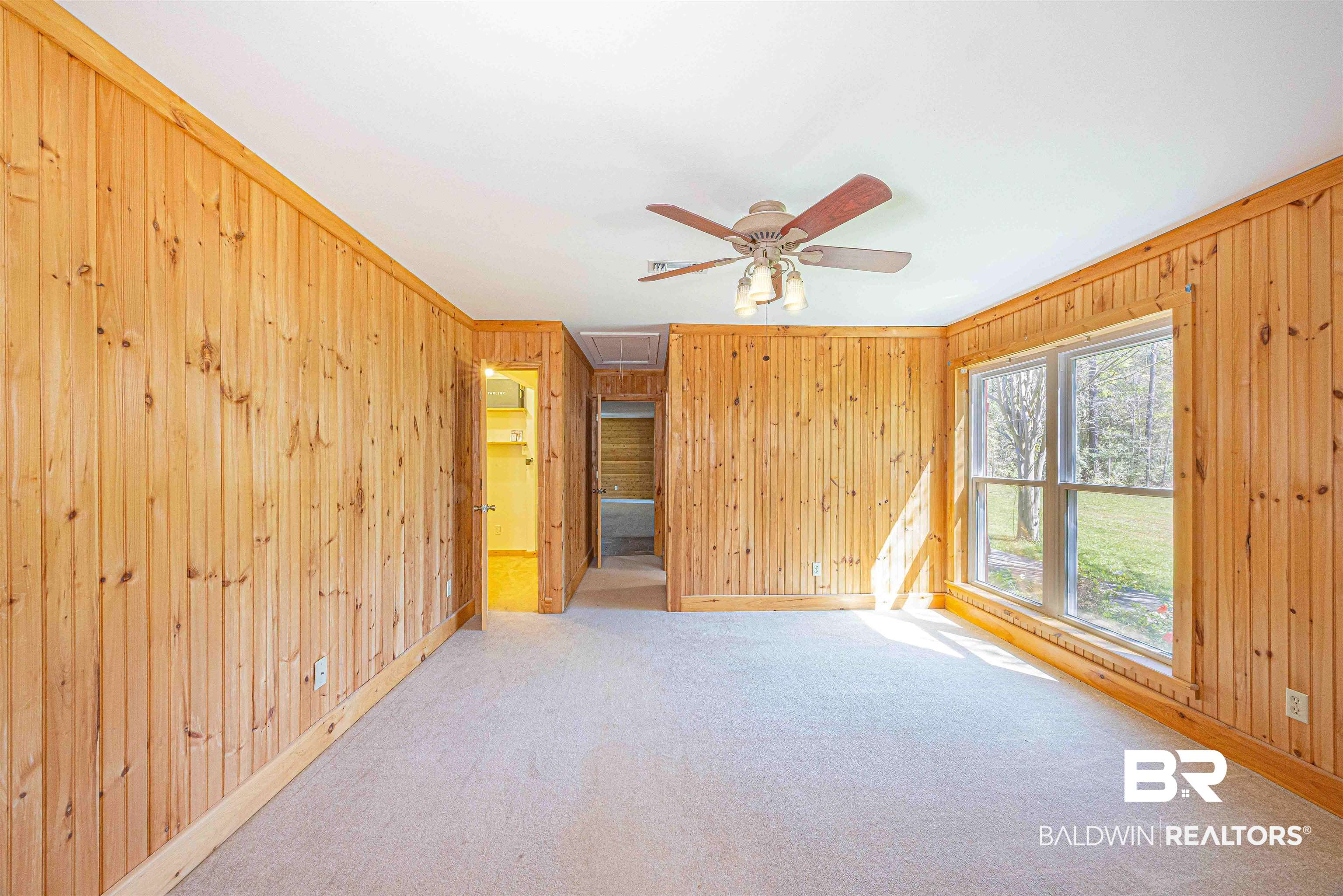 43101 Brown Road Bay Minette, AL 36507 - Photo 34 of 81 Unfurnished bedroom with wooden walls, carpet flooring, a ceiling fan, and crown molding