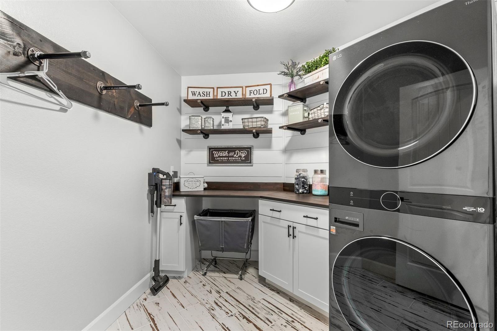 32335 Legacy Ridge Street Elizabeth, CO 80107 - Photo 22 of 50 a utility room with sink dryer and washer