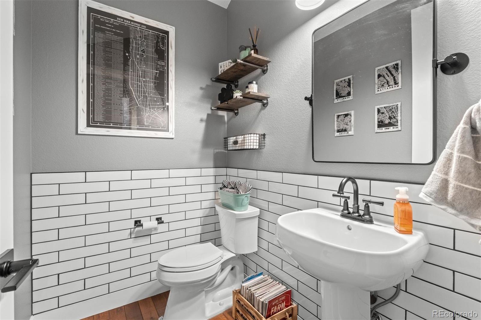32335 Legacy Ridge Street Elizabeth, CO 80107 - Photo 25 of 50 a bathroom with a toilet sink and mirror
