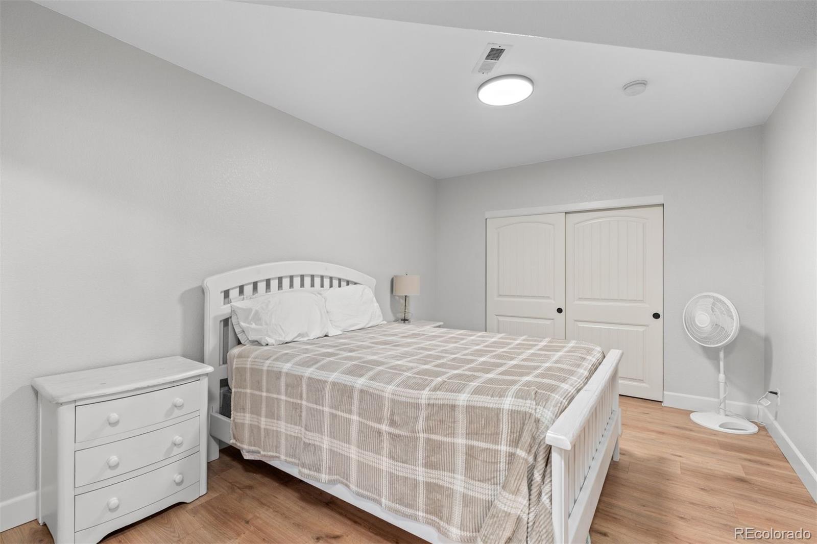 32335 Legacy Ridge Street Elizabeth, CO 80107 - Photo 35 of 50 a bedroom with a bed and window