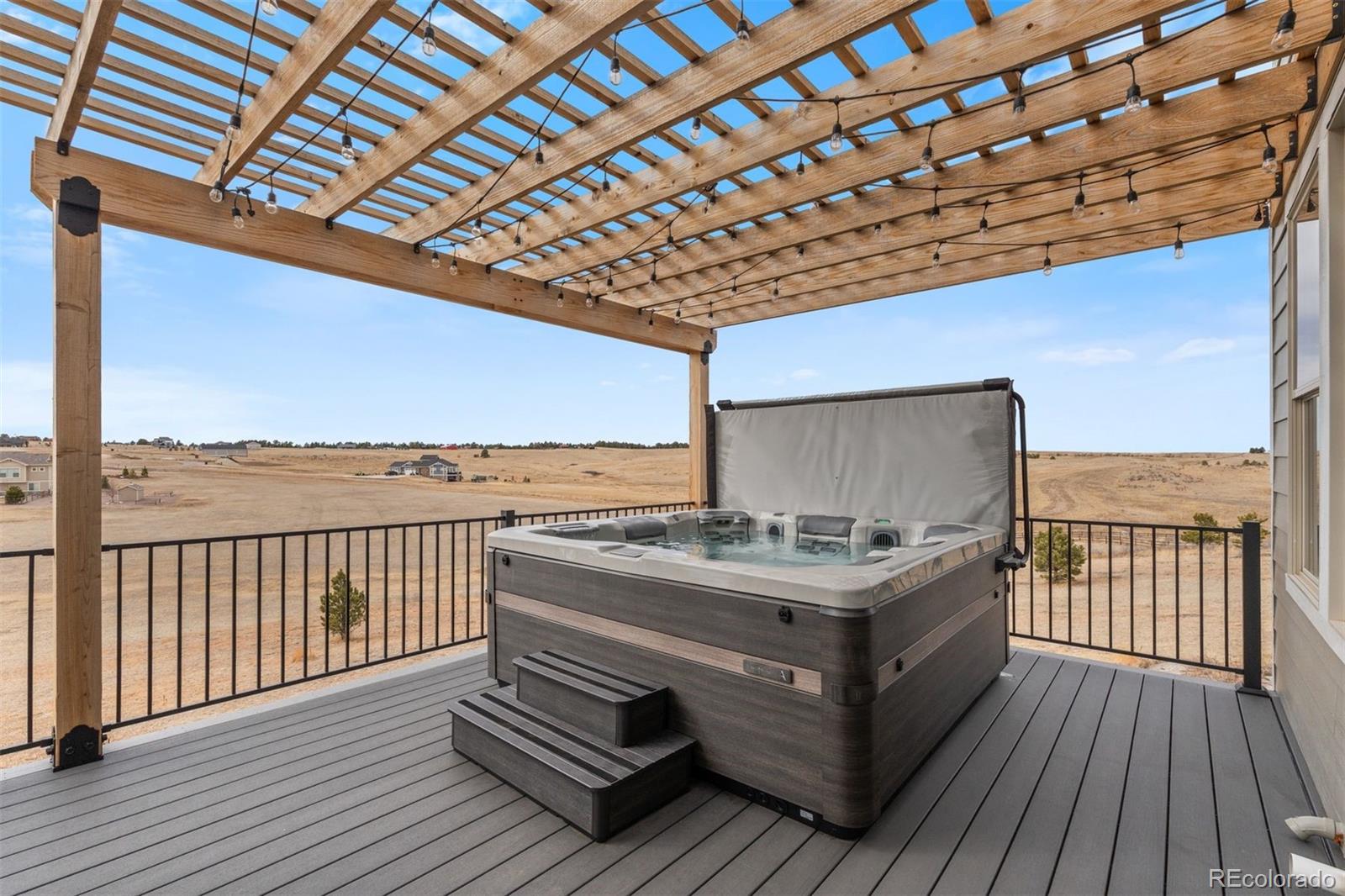32335 Legacy Ridge Street Elizabeth, CO 80107 - Photo 37 of 50 a view of a balcony with wooden floor