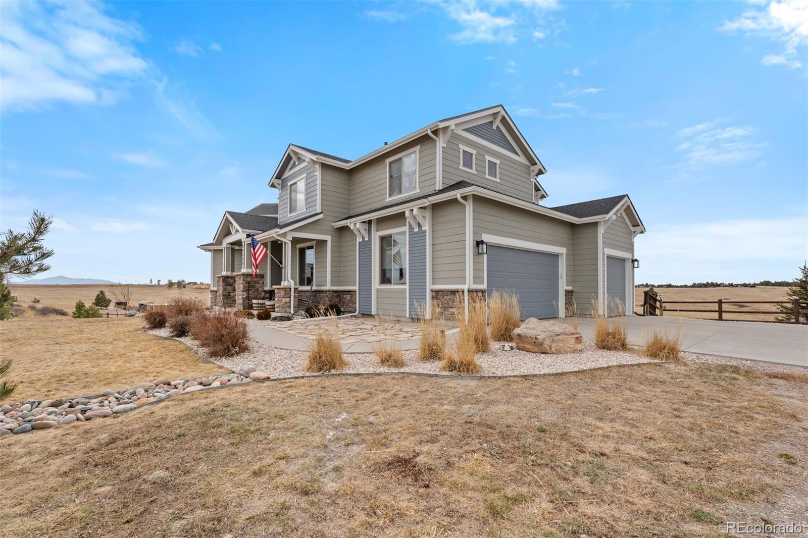 32335 Legacy Ridge Street Elizabeth, CO 80107 - Photo 38 of 50 a front view of a house with a yard