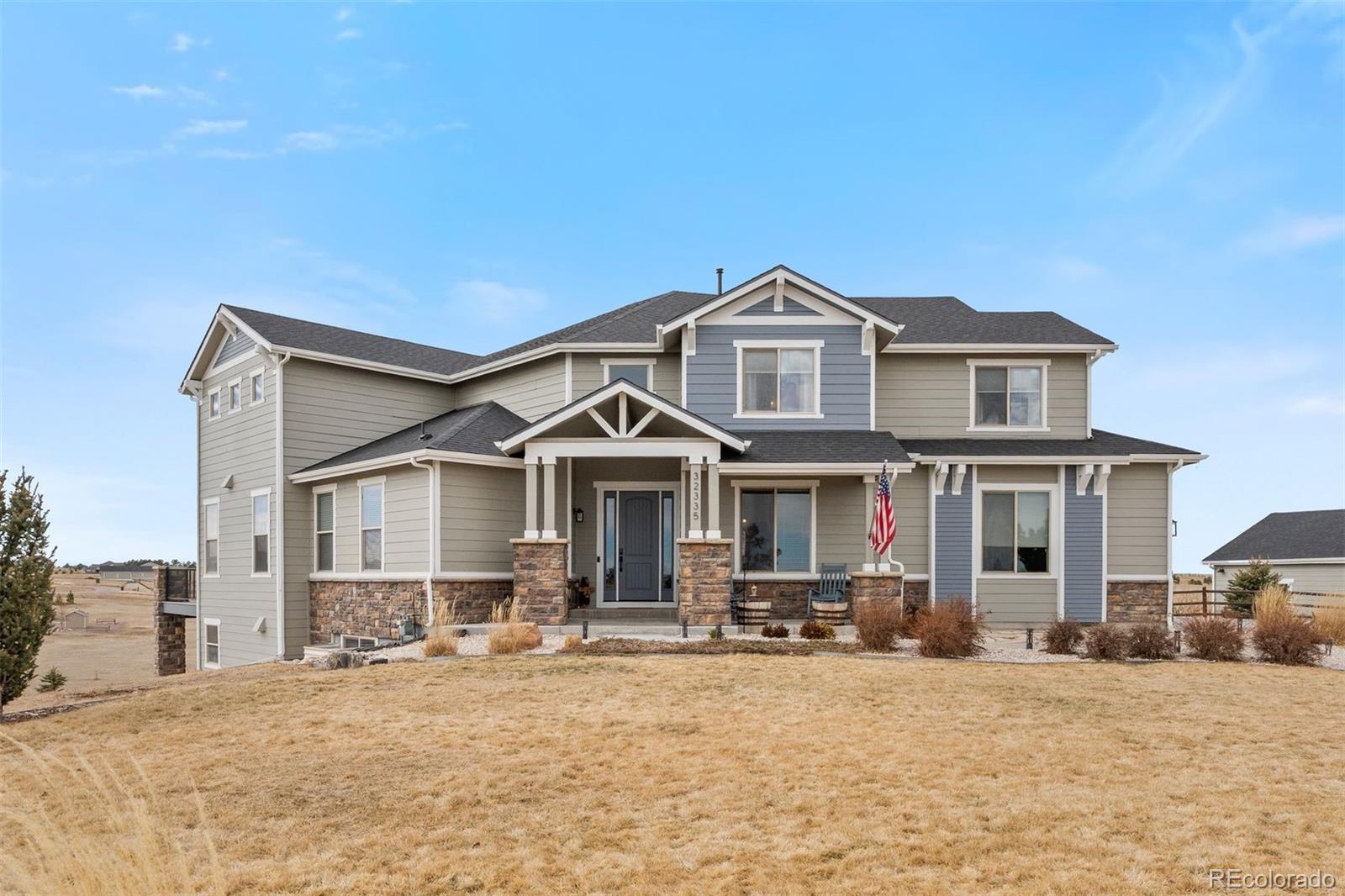 32335 Legacy Ridge Street Elizabeth, CO 80107 - Photo 42 of 50 a front view of a house with a yard
