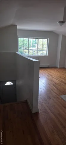 a kitchen with a refrigerator sink and cabinets